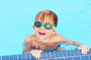 AdobeStock 133576793 swimmers ear swim baby water pool - Motherhood Center