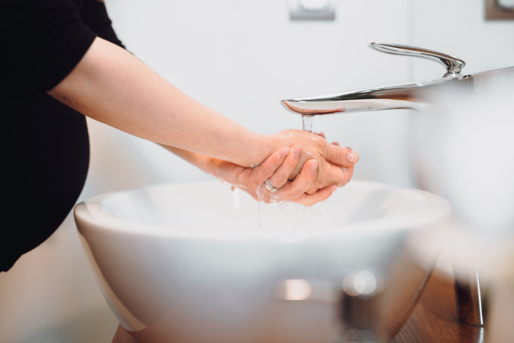 pregnant woman washing hands